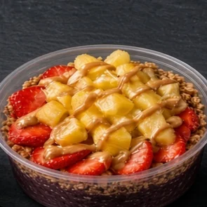 Diane’s Special bowl: açaí base with granola, strawberries, banana, pineapple chunks and a peanut butter drizzle