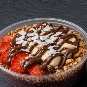 Nutella Dream bowl: açaí base with granola, strawberries, banana, coconut flakes and a Nutella drizzle