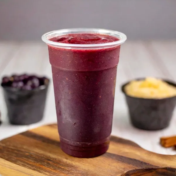Açaí Breeze smoothie made with coconut milk, probiotics & greens, chia seeds, açaí, pineapple, blueberry, strawberry