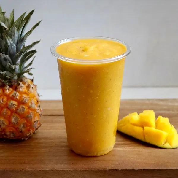 Tropical Mango smoothie made with apple juice, coconut milk, banana, mango, pineapple