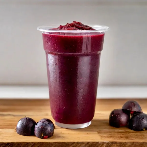 Very Berry Açaí smoothie made with coconut milk, apple juice, banana, açaí, blueberry, strawberry